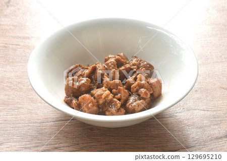 salty boiled slice dice pork meat in soy sauce on bowl 129695210