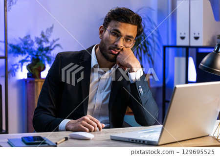 Indian businessman worried about financial problem, stress, money debt, budget loss, bankruptcy 129695525