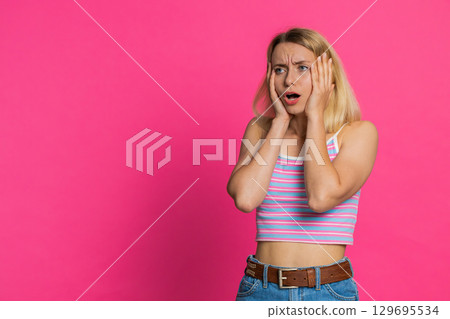 Sad young woman loses becoming surprised by lottery results bad fortune loss unlucky fortune news 129695534