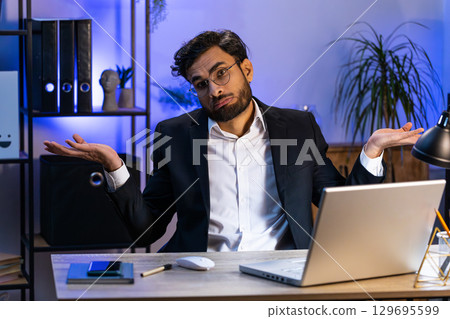 Confused businessman embarrassed about ambiguous question, having doubts, no answer idea, clueless Confused businessman embarrassed about ambiguous question, having doubts, no answer idea, clueless 129695599