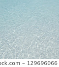 The transparent shallow ocean surface reflecting sunlight 129696066