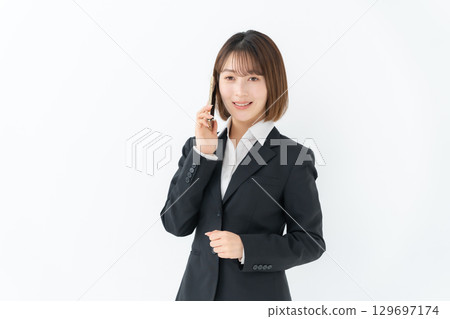 Young woman business smartphone call Young woman business smartphone call 129697174