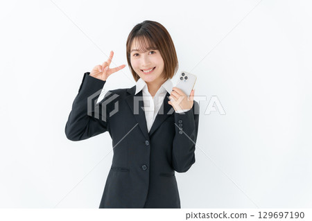 Young woman business smartphone peace 129697190