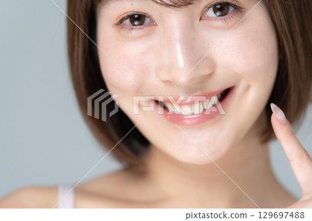 Dental care beauty young woman 129697488