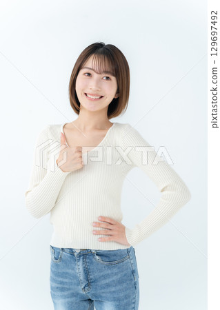 Young woman, casual, thumbs up Young woman, casual, thumbs up 129697492