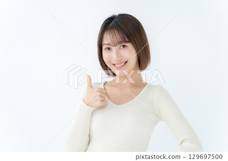 Young woman, casual, thumbs up 129697500
