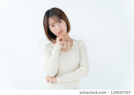 Young woman, casual, worried 129697507