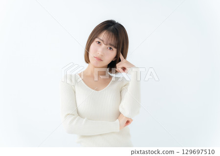 Young woman, casual, worried Young woman, casual, worried 129697510