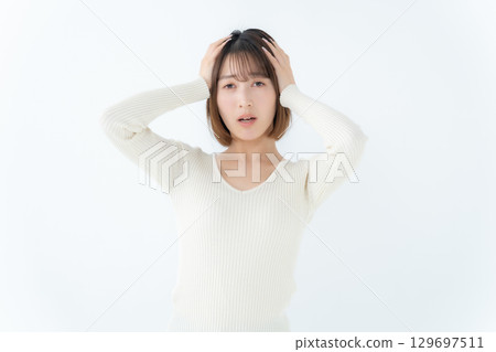 Young woman, casual, worried 129697511