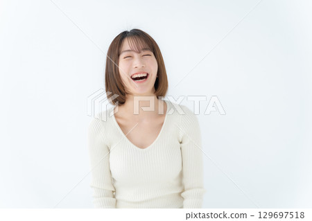 Young woman, casual, laughing 129697518