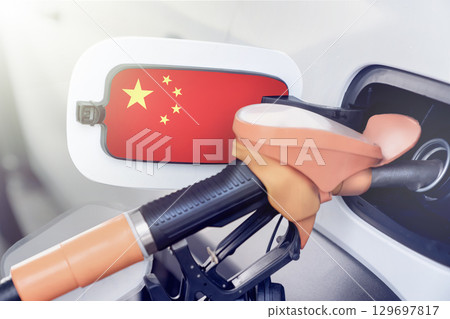 The flag of China on the hatch of the gas tank of a car at a gas station. Gasoline and diesel fuel in China. High prices for diesel fuel, gasoline and gas at gas stations in China. 129697817