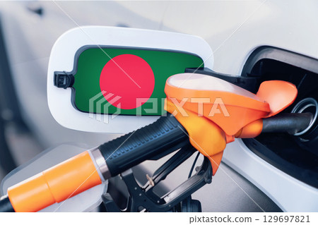 The flag of Bangladesh on the hatch of the gas tank of a car at a gas station. Gasoline and diesel fuel in Austria. High prices for diesel fuel, gasoline and gas at gas stations in Austria. 129697821