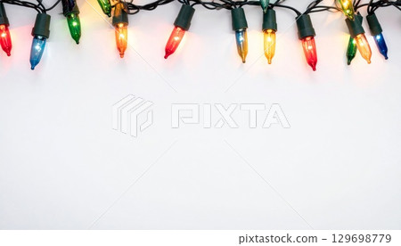 Festive Multicolored String Lights Garland on White Background for Holiday Decoration 129698779