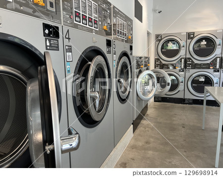 Stylish indoor coin laundry Stylish indoor coin laundry 129698914