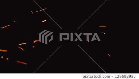hot sparks floating from side on black background 129698983
