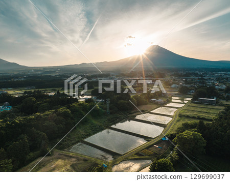 Drone aerial shot of Mount Fuji and rural scenery at dusk 129699037