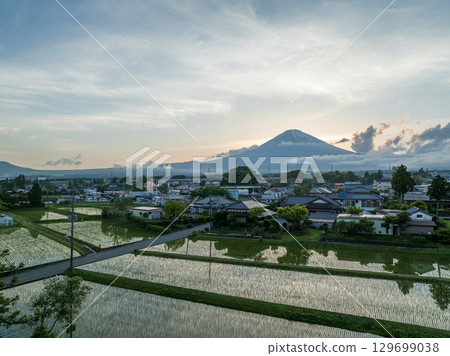 Drone aerial shot of a residential area with views of Mount Fuji and the Japanese countryside Drone aerial shot of a residential area with views of Mount Fuji and the Japanese countryside 129699038