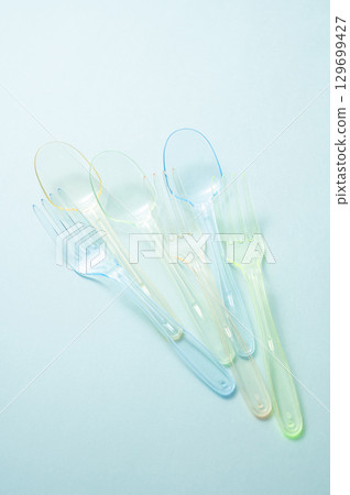 Plastic spoon and fork 129699427