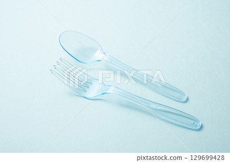 Plastic spoon and fork 129699428