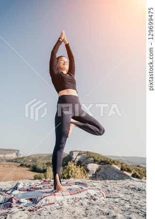 Yoga Pose in Nature - Tree Pose on a Clifftop Yoga Pose in Nature - Tree Pose on a Clifftop 129699475