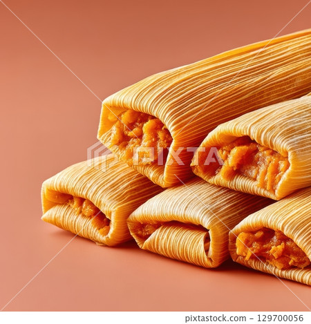 Delicious and Colorful Tamales Served on a Smooth Surface for Authentic Mexican Cuisine Experience 129700056