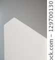 A minimalist landscape of light and shadows from a window reflected on a white wall 129700130