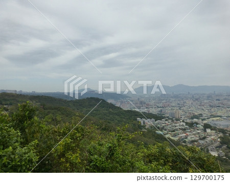 Taiwan New Taipei - 01.31.2025: Taipei Basin, Taipei Metropolitan Area, and Guanyin Mountain in the distance Taiwan New Taipei - 01.31.2025: Taipei Basin, Taipei Metropolitan Area, and Guanyin Mountain in the distance 129700175