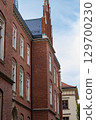 Side view of a historic Gothic university building 129700230