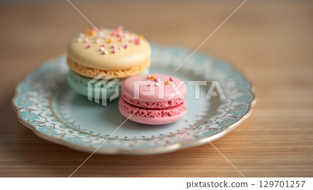 Delightful Colorful Macarons Stacked on a Decorative Plate Presenting an Inviting and Delicious Dessert Treat 129701257