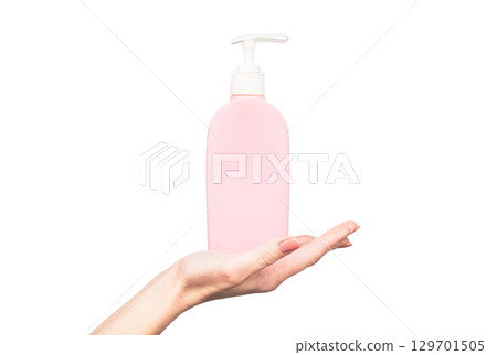 female hand hold soap bottle with copy space 129701505
