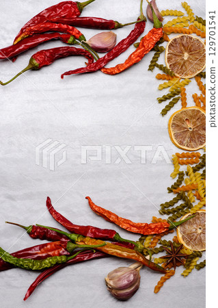 delicious colorful italian pasta and ingredients on textured background 129701541