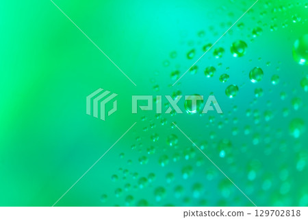 Water droplets/green background material 129702818