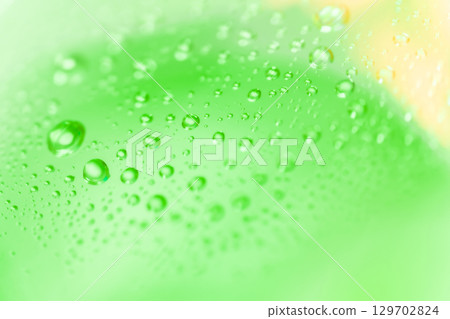 Water droplets/green background material 129702824