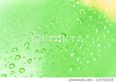 Water droplets/green background material 129702828