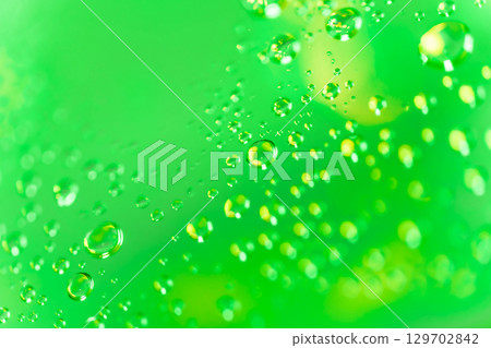 Water droplets/green background material Water droplets/green background material 129702842