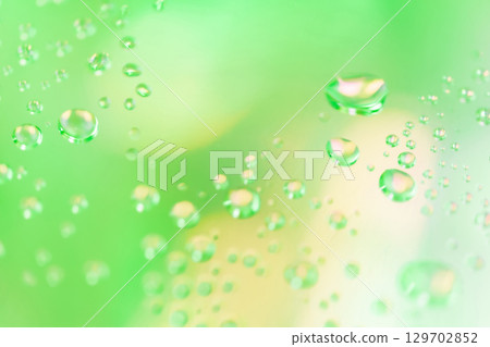 Water droplets/green background material Water droplets/green background material 129702852
