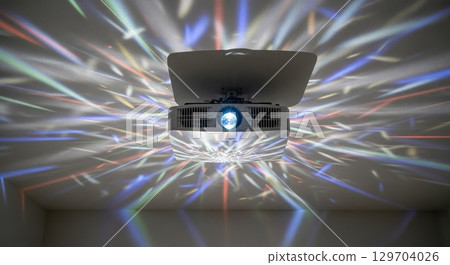 Professional projector with colorful light rays and prism effects 129704026