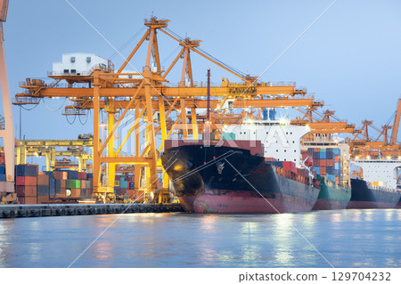 Crane and cargo ship at port in Bangkok City of Thailand. Crane and cargo ship at port in Bangkok City of Thailand. 129704232