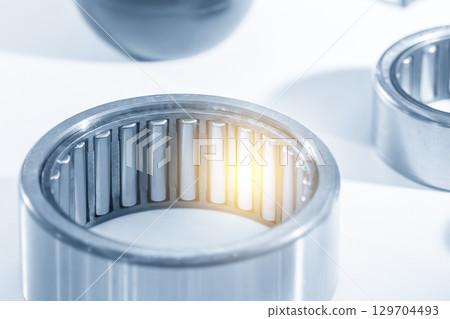 Close up scene the needle rolling  bearing parts in the blue tone scene. 129704493