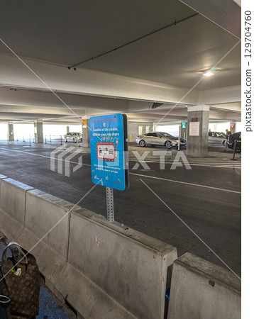 Gary Reed International Airport, Las Vegas, Nevada, USA - August 3, 2024: Taxi and carpool area at the airport exit Gary Reed International Airport, Las Vegas, Nevada, USA - August 3, 2024: Taxi and carpool area at the airport exit 129704760