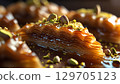 Delicious baklava with intricate layers and pistachio topping 129705123