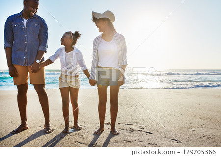 Black family, mother and father with girl, beach and vacation for summer, weekend break and bonding. Love, parents and daughter on seaside holiday, sand and happiness for traveling and holding hands Black family, mother and father with girl, beach and vacation for summer, weekend break and bonding. Love, parents and daughter on seaside holiday, sand and happiness for traveling and holding hands 129705366