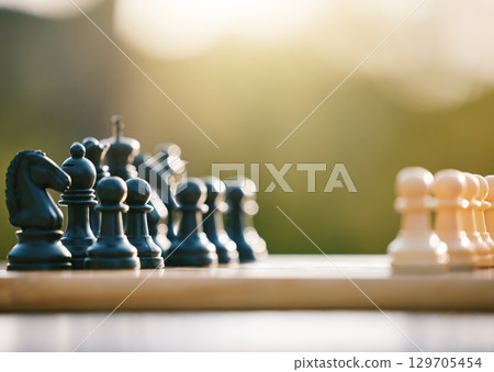 Game, smart and chess sport in nature for a challenge, strategy and brain competition in Ireland. Battle, match and board for games, strategic fun and tactics in a park or field for logic play Game, smart and chess sport in nature for a challenge, strategy and brain competition in Ireland. Battle, match and board for games, strategic fun and tactics in a park or field for logic play 129705454