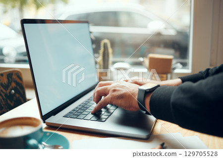 Laptop screen, mockup and hands in coffee shop for e learning, student online education and phd research. Computer mock up, internet cafe and person studying, typing and website information search Laptop screen, mockup and hands in coffee shop for e learning, student online education and phd research. Computer mock up, internet cafe and person studying, typing and website information search 129705528