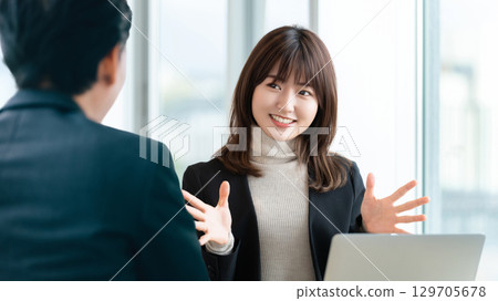 Smiling woman/businesswoman having a conversation Smiling woman/businesswoman having a conversation 129705678