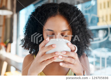 Person, relax or drinking coffee in cafe or restaurant for lunch break, mindfulness or self love zen. Beverage, student or black woman with tea cup drink for personal time, inspiration or calm peace 129705698