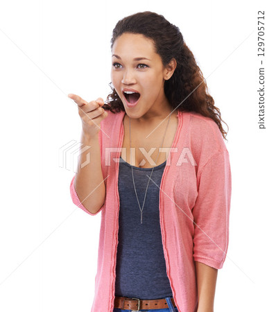 Excited, pointing and black woman surprise, shocked or happy girl isolated on white studio background. African American female, lady and point with achievement, marketing or advertising with discount 129705712