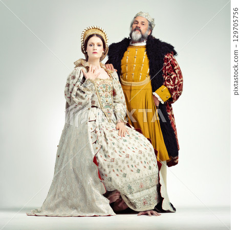 Fashion, medieval and king with queen on a white background for power, leaders and ruler. History, theatre and royal couple portrait in vintage, renaissance and Victorian cosplay isolated in studio 129705756