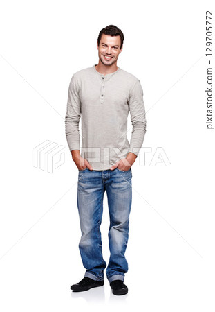 Portrait, smile and man with hands in pocket in studio isolated on a white background looking happy. Pride, cool and model male posing in denim jeans clothes for trendy style and positive mindset Portrait, smile and man with hands in pocket in studio isolated on a white background looking happy. Pride, cool and model male posing in denim jeans clothes for trendy style and positive mindset 129705772