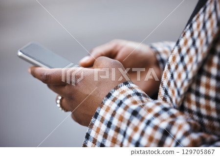Closeup, black hands and smartphone for typing, outdoor and connection for social media, chatting and online reading. African woman, zoom and female with cellphone, city and communication with device Closeup, black hands and smartphone for typing, outdoor and connection for social media, chatting and online reading. African woman, zoom and female with cellphone, city and communication with device 129705867